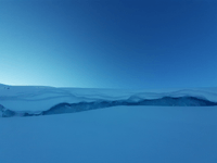 snow piled up on a small calving front of a lake-terminating glacier