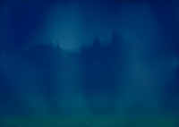 a blueish tinted image with the silhouette of a roofline with a few chimenys. the sihouette is repeated, more faintly above